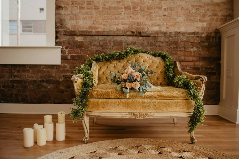Cozy loveseat setup with neutral tones and soft lighting