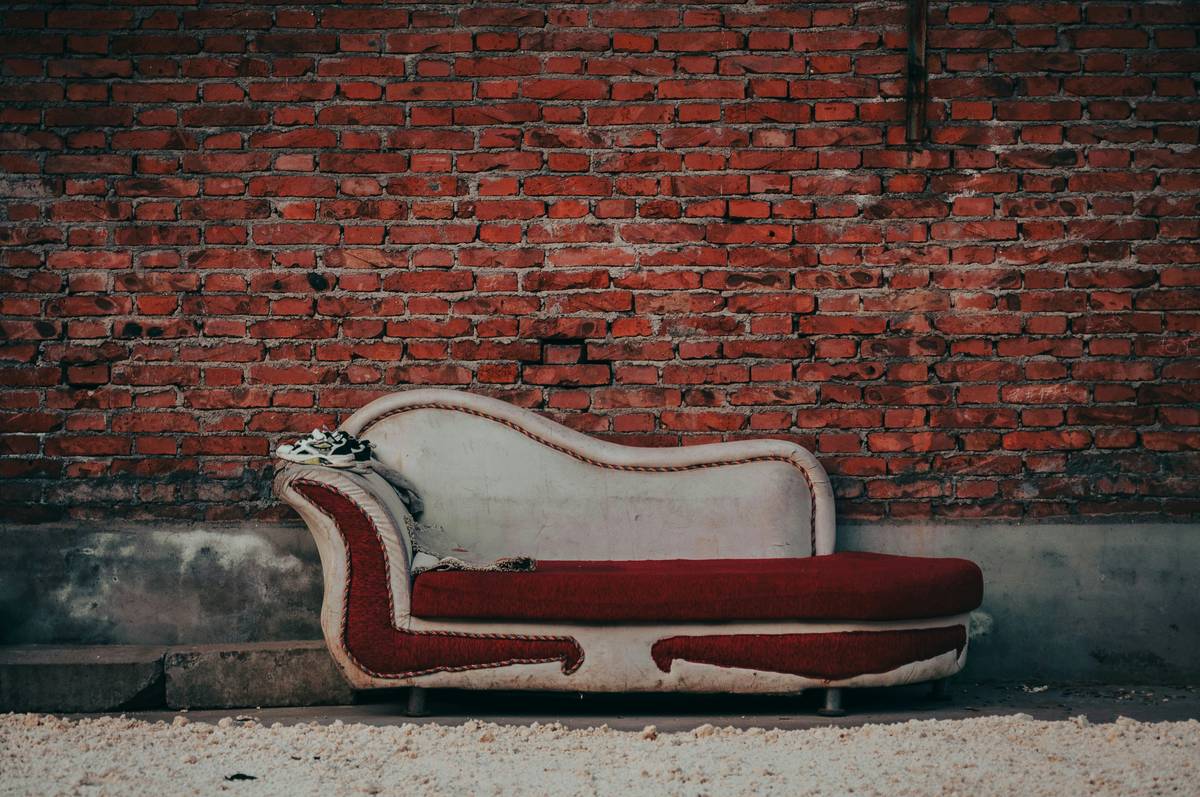 Diagram showing dimensions and arm orientation of a typical love seat with chaise, labeled with key measurements: total width, depth, chaise extension length, and seat height