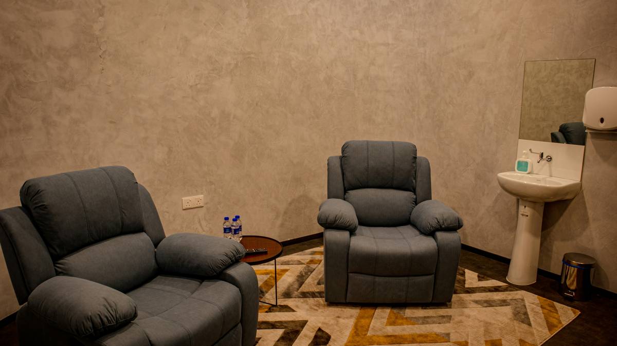 Cutaway diagram showing internal reclining mechanism in a love seat versus standard sofa